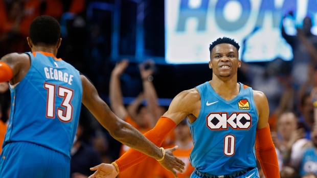 Russell Westbrook celebrates with Paul George 