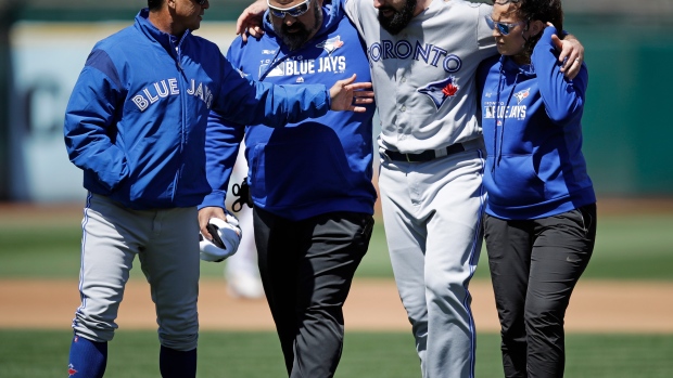  Jays manager Charlie Montoyo speaks with injured pitcher Matt Shoemaker