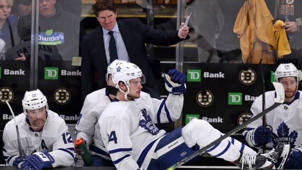 Dejected Leafs players and coach Mike Babcock look on from the bench Tuesday.