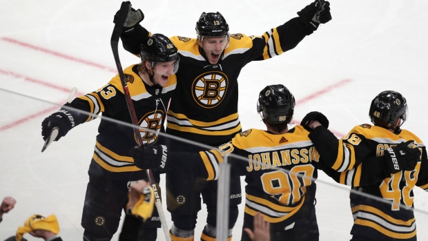 Charlie Coyle and his teammates celebrate his game winning goal 