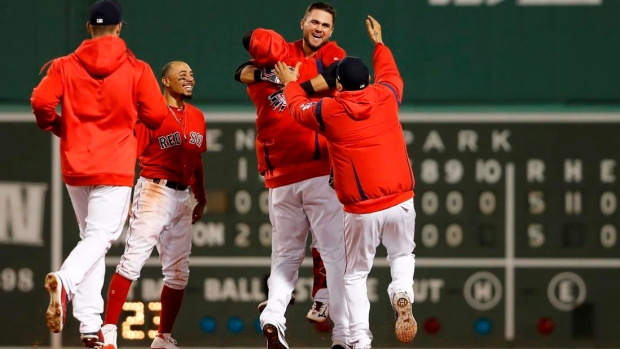 Michael Chavis celebrates with teammates 