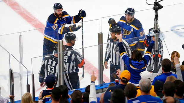 St. Louis Blues players argue a call