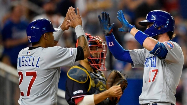 Kris Bryant and Addison Russell celebrate , The Canadian Press Kris Bryant and Addison Russell celebrate
