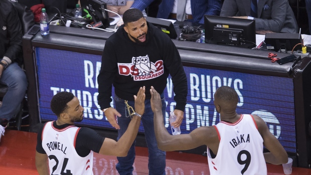 Norman Powell, Serge Ibaka and Drake, The Canadian Press Norman Powell, Serge Ibaka and Drake