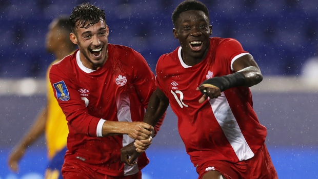 Alphonso Davies and Russell Teibert