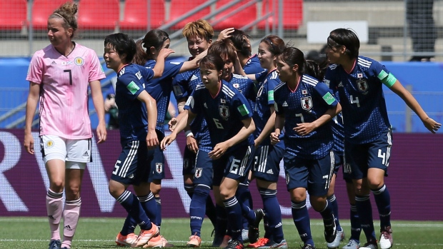 Japan's Mana Iwabuchi Celebrates with team, The Canadian Press Japan's Mana Iwabuchi Celebrates with team