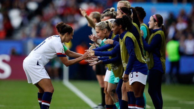 Carli Lloyd celebrates with bench , The Canadian Press Carli Lloyd celebrates with bench