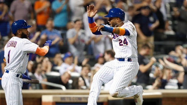Amed Rosario and Robinson Cano, The Canadian Press Amed Rosario and Robinson Cano