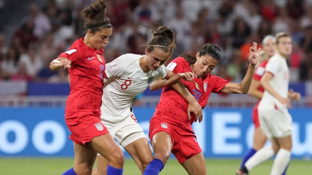 Carli Lloyd and Christen Press battle with Jill Scott, The Canadian Press Carli Lloyd and Christen Press battle with Jill Scott