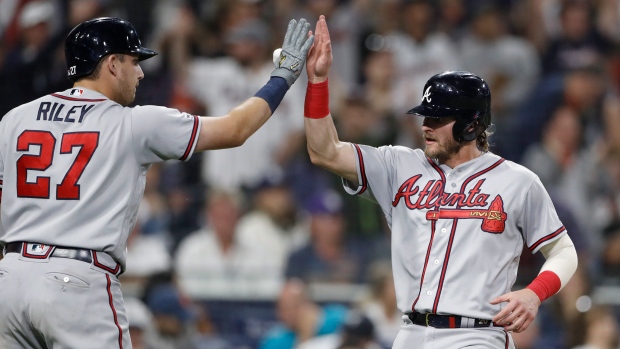 Josh Donaldson is greeted by Austin Riley 