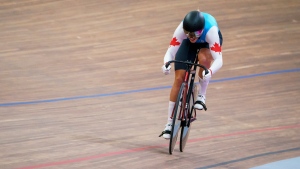 Mitchell sets track cycling record, advances to quarterfinals