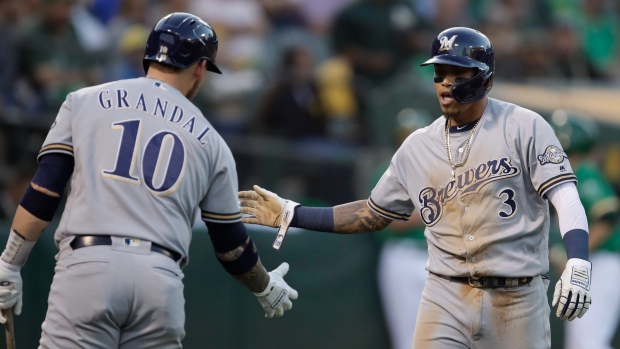 Yasmani Grandal, Orlando Arcia, The Canadian Press Yasmani Grandal, Orlando Arcia