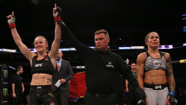 Valentina Shevchenko celebrates after her victory over Liz Carmouche