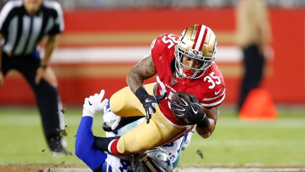 San Francisco 49ers' Brandon Wilds is tackled by Dallas Cowboys' Justin Phillips