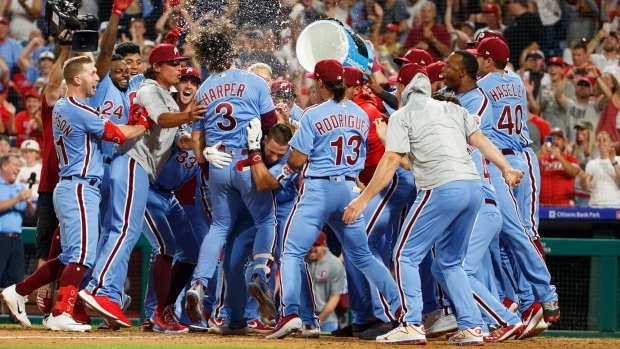 Bryce Harper, teammates, The Canadian Press Bryce Harper, teammates