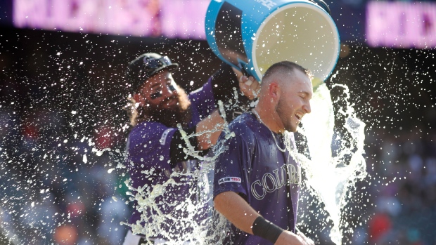 Charlie Blackmon and Garrett Hampson, The Canadian Press Charlie Blackmon and Garrett Hampson