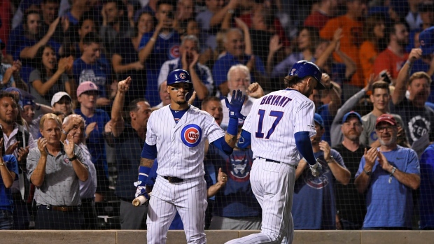 Kris Bryant celebrates with Javier Baez, The Canadian Press Kris Bryant celebrates with Javier Baez