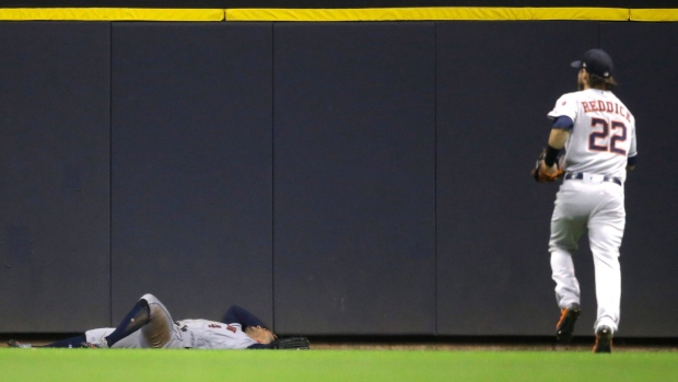 George Springer Josh Reddick, The Canadian Press George Springer Josh Reddick