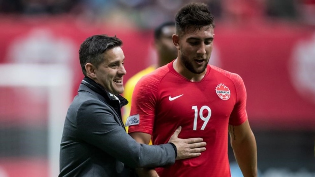 John Herdman and Lucas Cavallini , The Canadian Press John Herdman and Lucas Cavallini