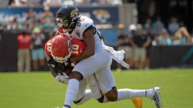 Tyreek Hill (10) is stopped by Jacksonville Jaguars cornerback Jalen Ramsey