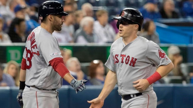 JD Martinez, Brock Holt , The Canadian Press JD Martinez, Brock Holt