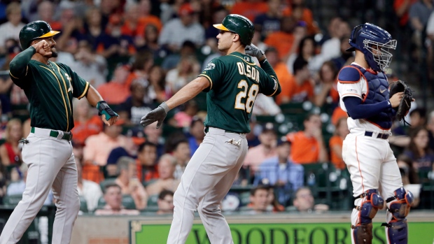 Marcus Semien, Matt Olson and Robinson Chirinos, The Canadian Press Marcus Semien, Matt Olson and Robinson Chirinos