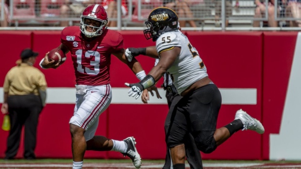 Tua Tagovailoa and Demarrio Smith, The Canadian Press Tua Tagovailoa and Demarrio Smith