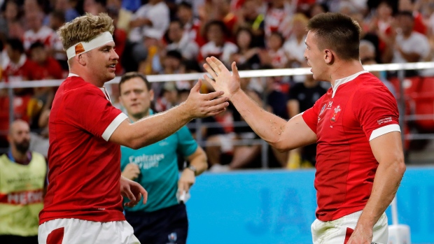Wales' Josh Adams and Aaron Wainwright , The Canadian Press Wales' Josh Adams and Aaron Wainwright