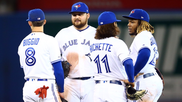 Rowdy Tellez of the Toronto Blue Jays poses with former high