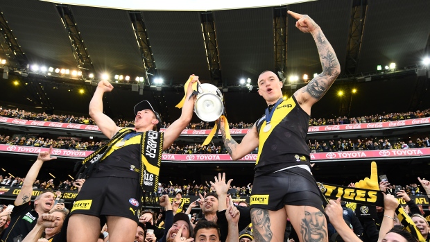 Liam Baker and Dustin Martin, Quinn Rooney/Getty Images Liam Baker and Dustin Martin