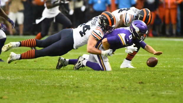 Minnesota Vikings quarterback Kirk Cousins (8) fumbles as he is sacked by Chicago Bears