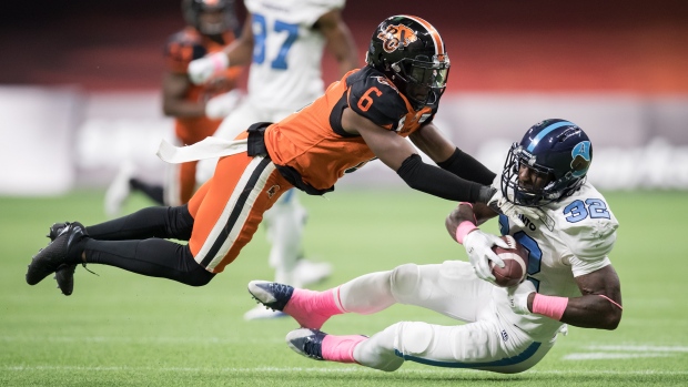 BC Lions re-sign . Lee III 