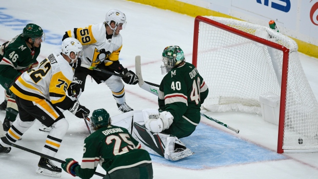 Patric Hornqvist, left, shoots the puck past Minnesota Wild goalie Devan Dubnyk (40), The Canadian Press Patric Hornqvist, left, shoots the puck past Minnesota Wild goalie Devan Dubnyk (40)