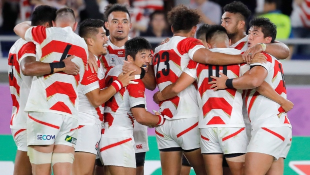 Japan rugby players celebrate