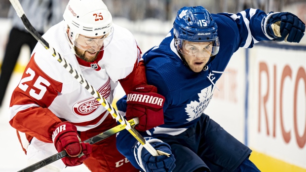 Leafs centre Alexander Kerfoot battles Red Wings defenceman Mike Green., The Canadian Press Leafs centre Alexander Kerfoot battles Red Wings defenceman Mike Green.
