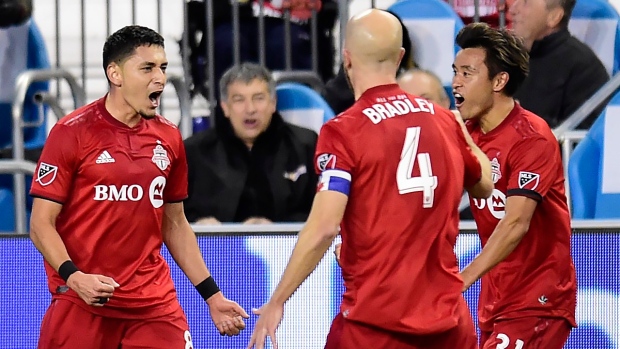 Marco Delgado (8) celebrates his goal with teammates Michael Bradley (4) and Tsubasa Endoh (31), The Canadian Press Marco Delgado (8) celebrates his goal with teammates Michael Bradley (4) and Tsubasa Endoh (31)