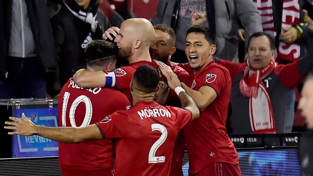 Toronto FC celebrates an extra time goal , The Canadian Press Toronto FC celebrates an extra time goal