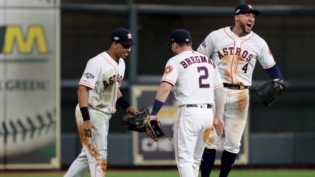 Michael Brantley, Alex Bregman, George Springer, The Canadian Press Michael Brantley, Alex Bregman, George Springer