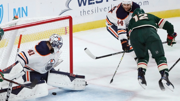 Eric Staal scores on Mike Smith , The Canadian Press Eric Staal scores on Mike Smith