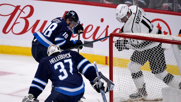 Connor Hellebuyck, Anze Kopitar and Bryan Little