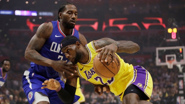 LeBron James and Kawhi Leonard , The Canadian Press LeBron James and Kawhi Leonard