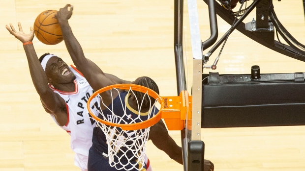 Pascal Siakam shoots over Pelicans' Jrue Holiday Tuesday night.