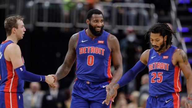 Luke Kennard, Andre Drummond, Derrick Rose , The Canadian Press Luke Kennard, Andre Drummond, Derrick Rose