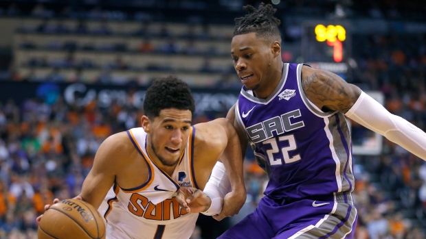 Devin Booker and Richaun Holmes, The Canadian Press Devin Booker and Richaun Holmes