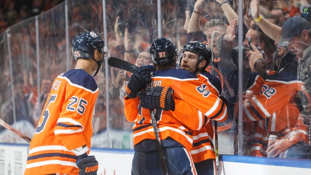 Darnell Nurse (25), Connor McDavid (97) and Leon Draisaitl (29)