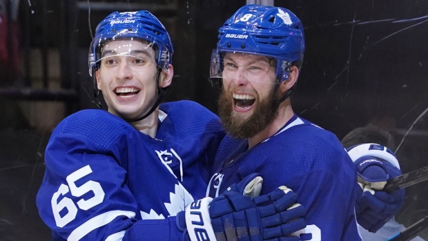 Jake Muzzin, right, celebrates with Ilya Mikheyev Friday night.