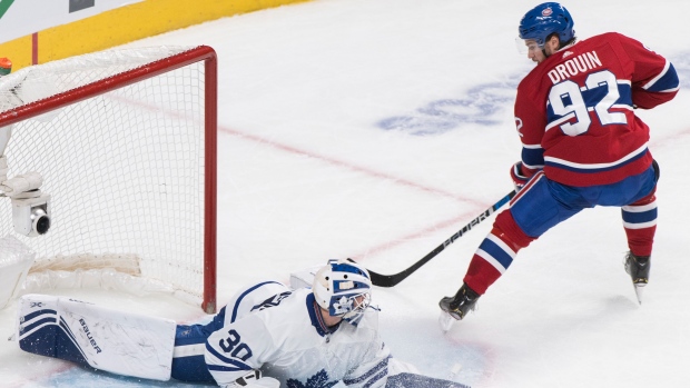 Jonathan Drouin scores on Michael Hutchinson , The Canadian Press Jonathan Drouin scores on Michael Hutchinson