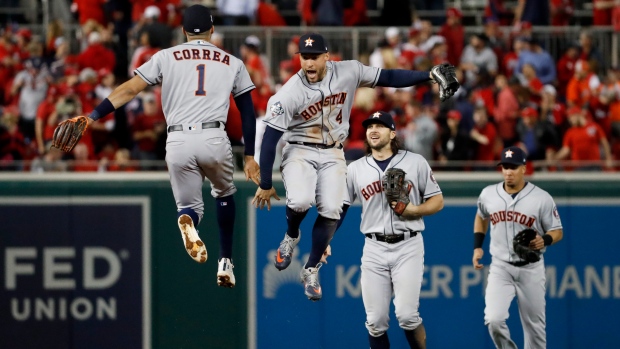 Carlos Correa and George Springer, The Canadian Press Carlos Correa and George Springer