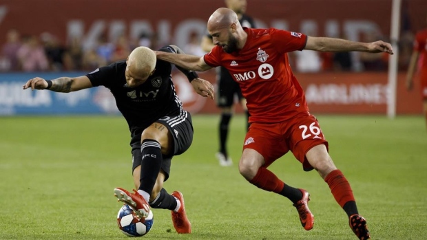 Laurent Ciman (26) and Yohan Croizet (10)