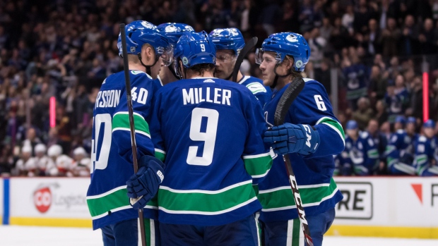 Vancouver Canucks celebrate, The Canadian Press Vancouver Canucks celebrate
